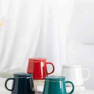Side view of minimalist ceramic tea infuser mug with lid