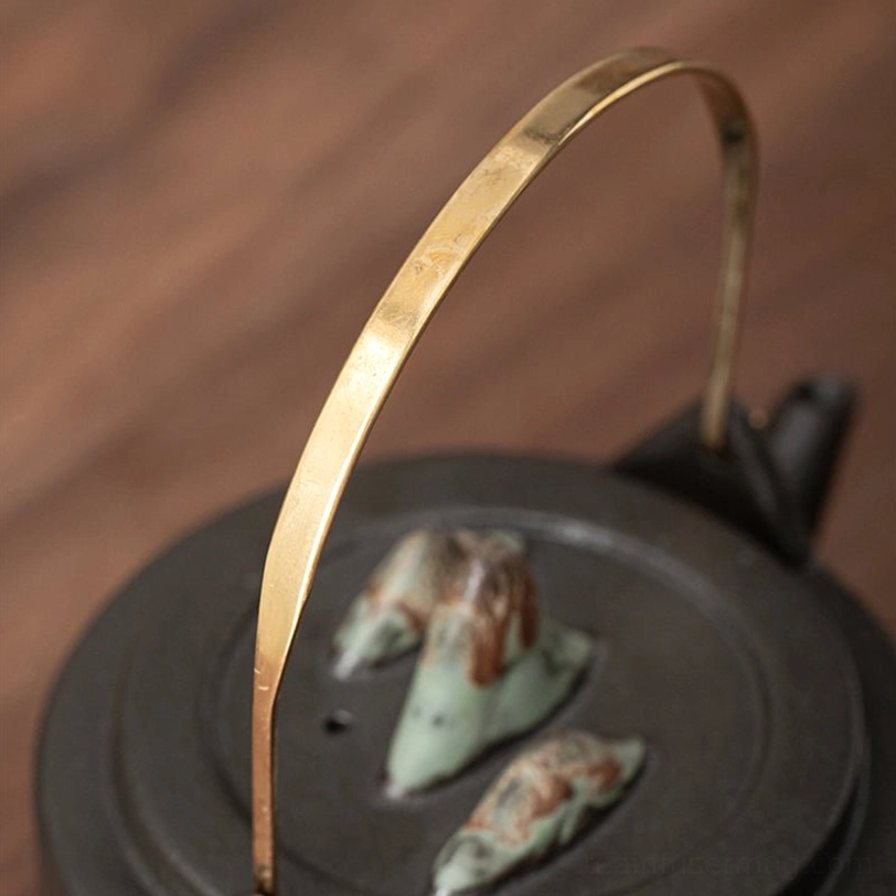 mountain ceramic teapot with infuser on matching bamboo tea tray