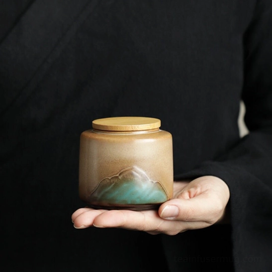 mountain relief ceramic tea storage canister with bamboo lid front view