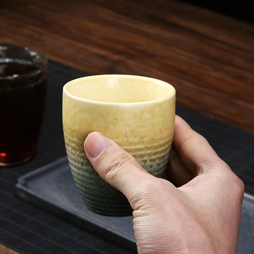 multiple 200ml japanese ceramic tea cups arranged on wood background