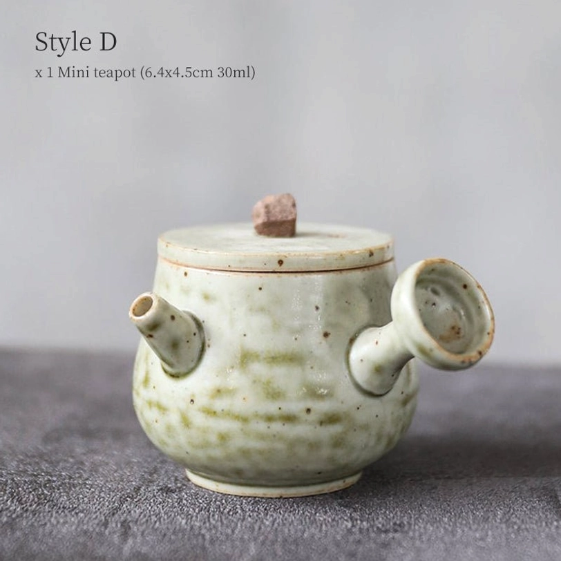 multiple mini ceramic teapots different styles displayed together