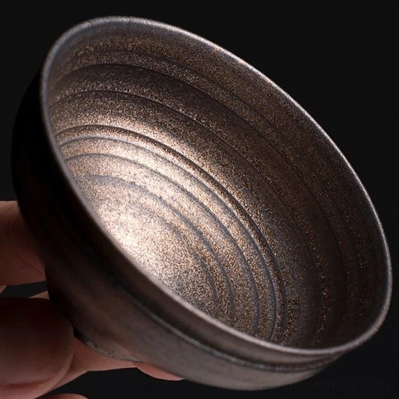 multiple sizes of vintage bronze ceramic chinese tea cups