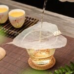full view of natural bodhi leaf tea strainer with wooden tag