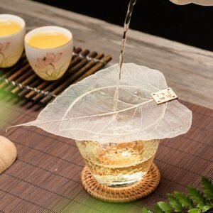 full view of natural bodhi leaf tea strainer with wooden tag
