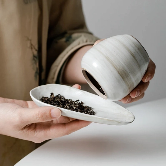 natural texture and finish on the white ceramic tea storage canister body