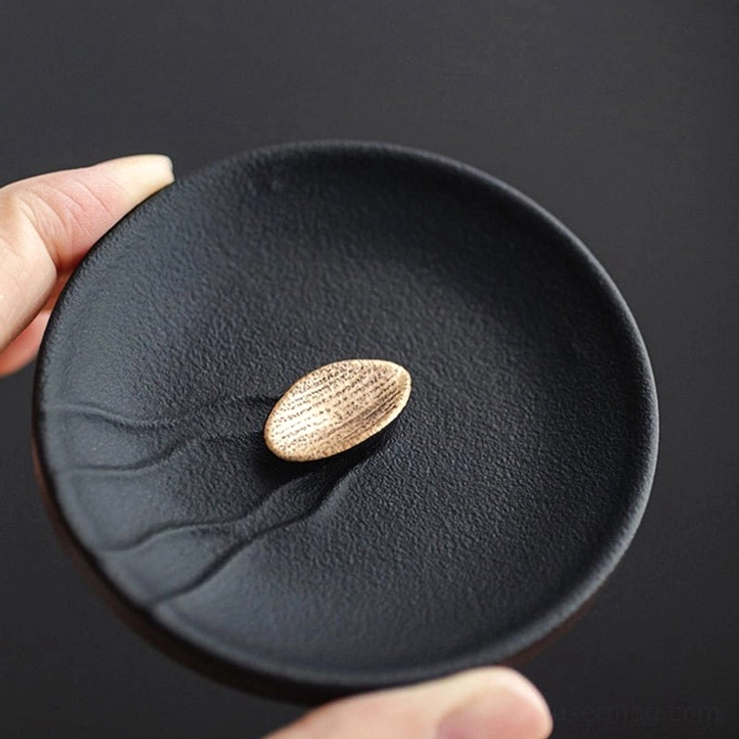 close up of natural insulated wooden handle on ceramic tea infuser mug