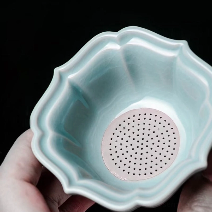 all ceramic pieces nested together for travel tea set storage