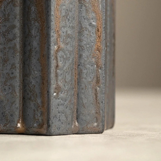 open ceramic tea storage canister showing linen sealed lid underside