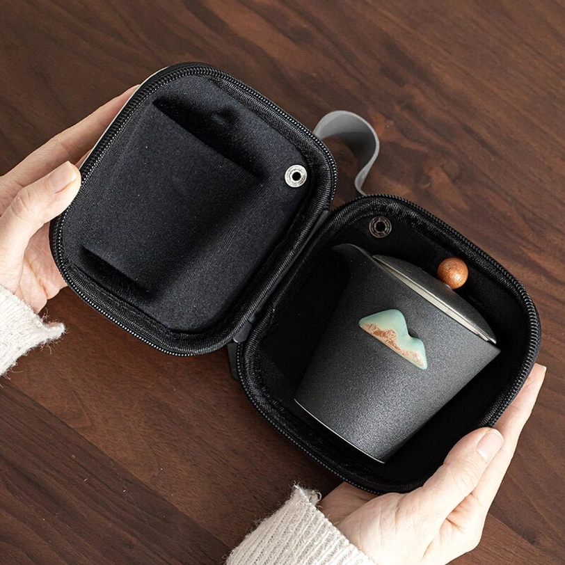 Open travel tea set carry bag showing padded inner lining