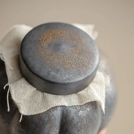Open ceramic tea storage canister showing interior capacity