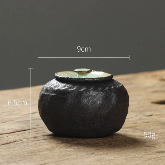 open ceramic tea storage canister showing interior