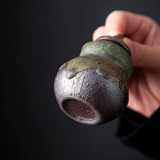 top view of open gourd ceramic tea storage canister