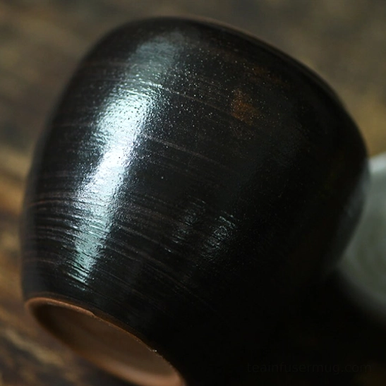 Opened ceramic tea storage canister showing empty interior