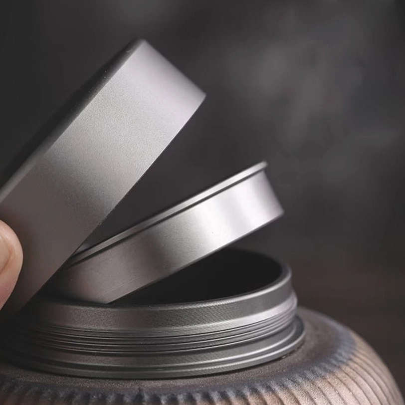 ceramic tea storage canister with opened metal lid