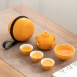 Full closed orange travel tea set in carry bag