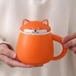Full view of orange Shiba Inu ceramic tea infuser mug with lid