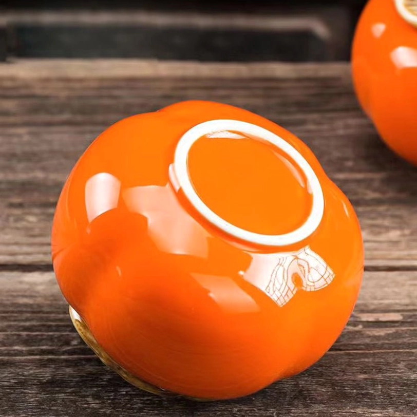 base view of orange persimmon ceramic tea storage caddy