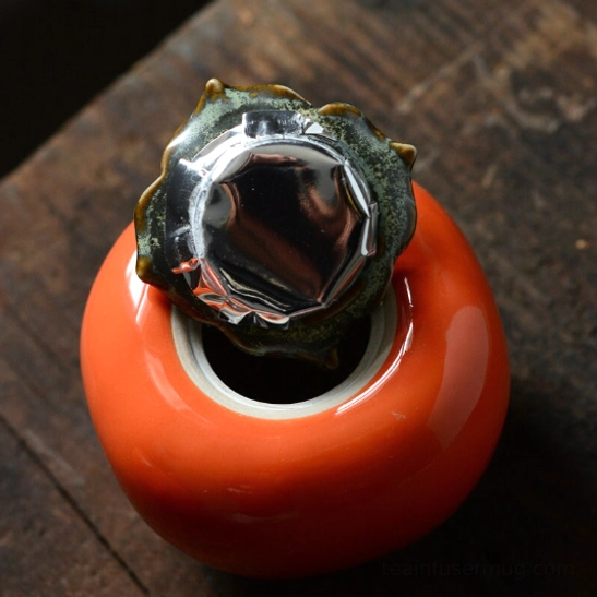 Inner seal of persimmon tea storage canister lid showing airtight design