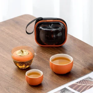 Full persimmon shaped portable travel tea set with carry bag displayed