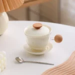 pink glass tea infuser mug set with ceramic filter and natural wood handle