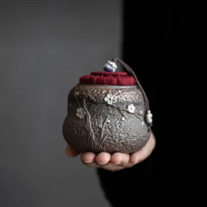 plum blossom relief ceramic tea storage canister full view