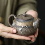 full view of 200ml plum blossom coarse pottery teapot with infuser