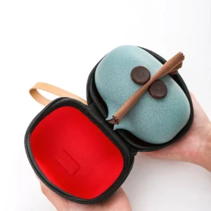 open travel tea set case showing all ceramic components arranged inside