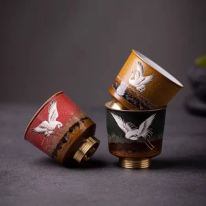 red crane chinese ceramic tea cup with copper base side view