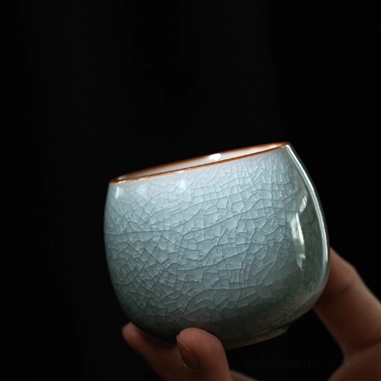 close up of the ice crackle glaze texture on ru kiln chinese tea cup