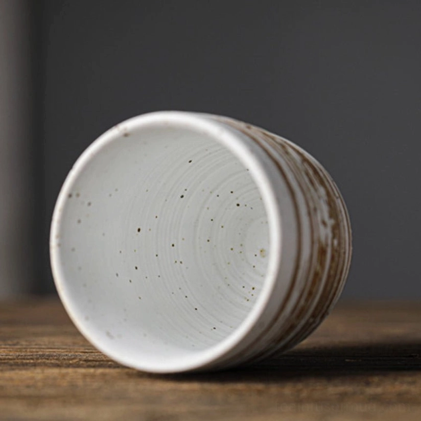 close up of wheel-thrown texture on a rustic Chinese clay tea cup