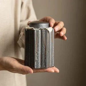 full front view of rustic fluted ceramic tea storage canister
