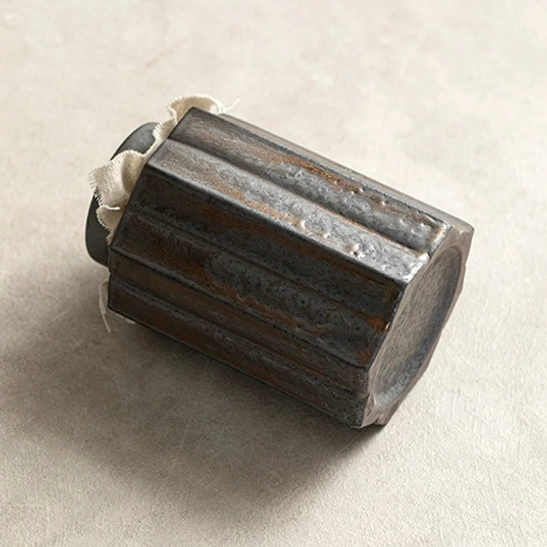 close up of lid top of the rustic iron glaze ceramic tea canister