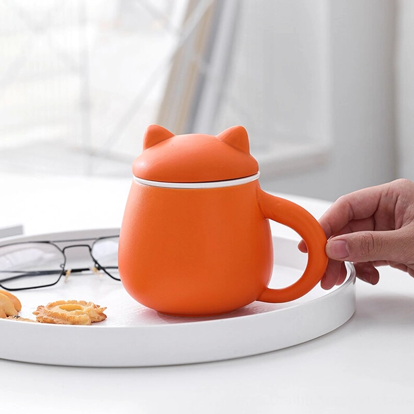 Shiba Inu ceramic tea infuser mug placed on a wooden office desk