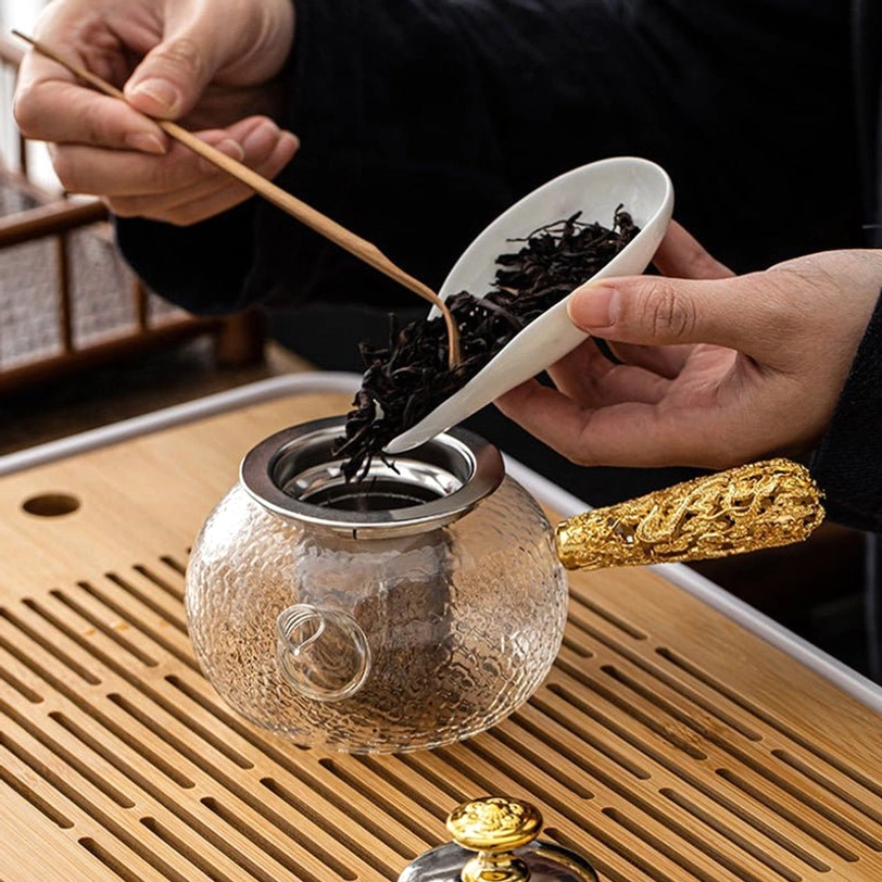 side angle view of 125ml glass kyusu teapot with infuser