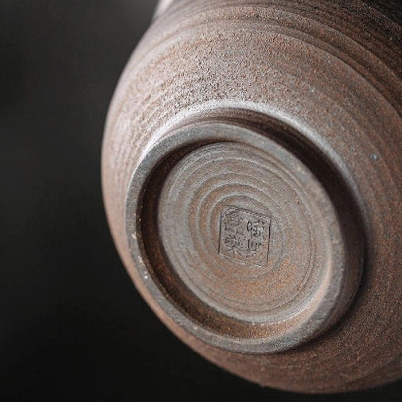 side profile of ceramic gaiwan tea cup on lotus saucer