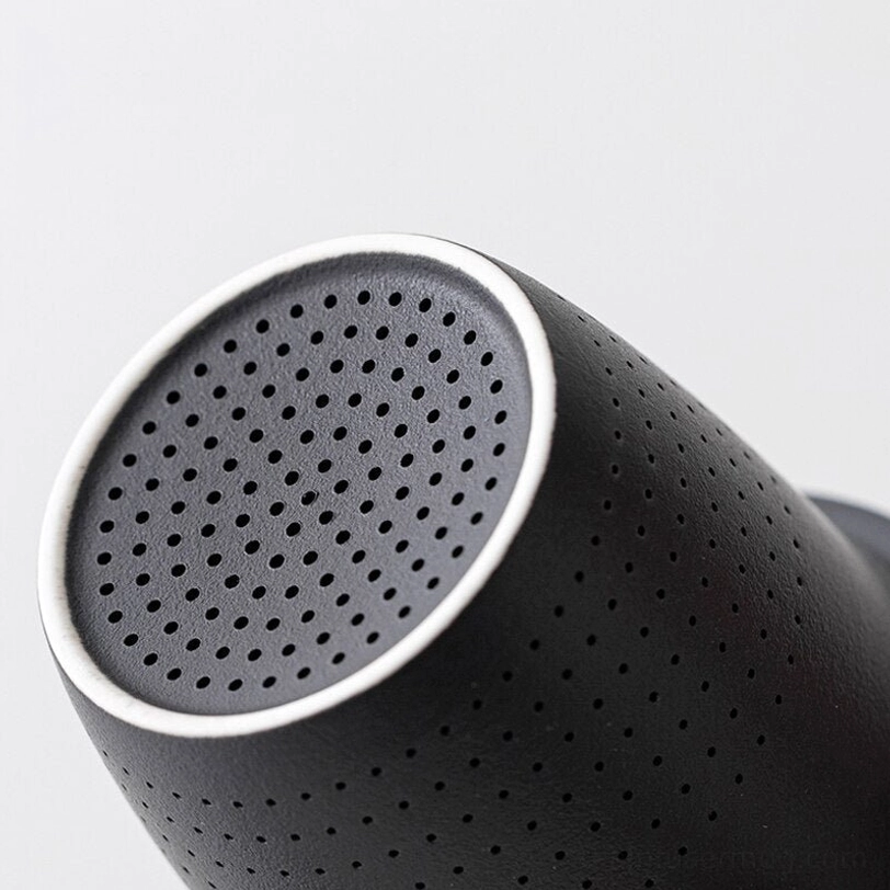 side view of fully assembled ceramic tea infuser mug with wooden lid