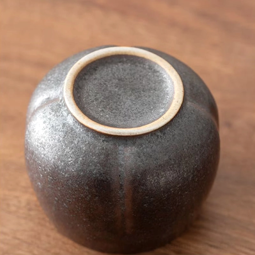 side view of four mixed color chinese ceramic tea cups showing height and shape