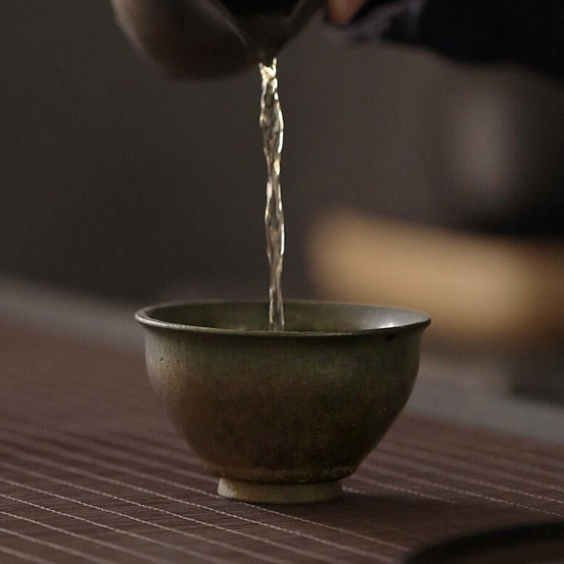 Side profile view of four different gilded clay tea cup styles to compare shape