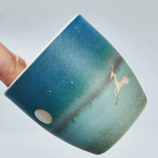 side profile of gradient deer ceramic tea cup showing height