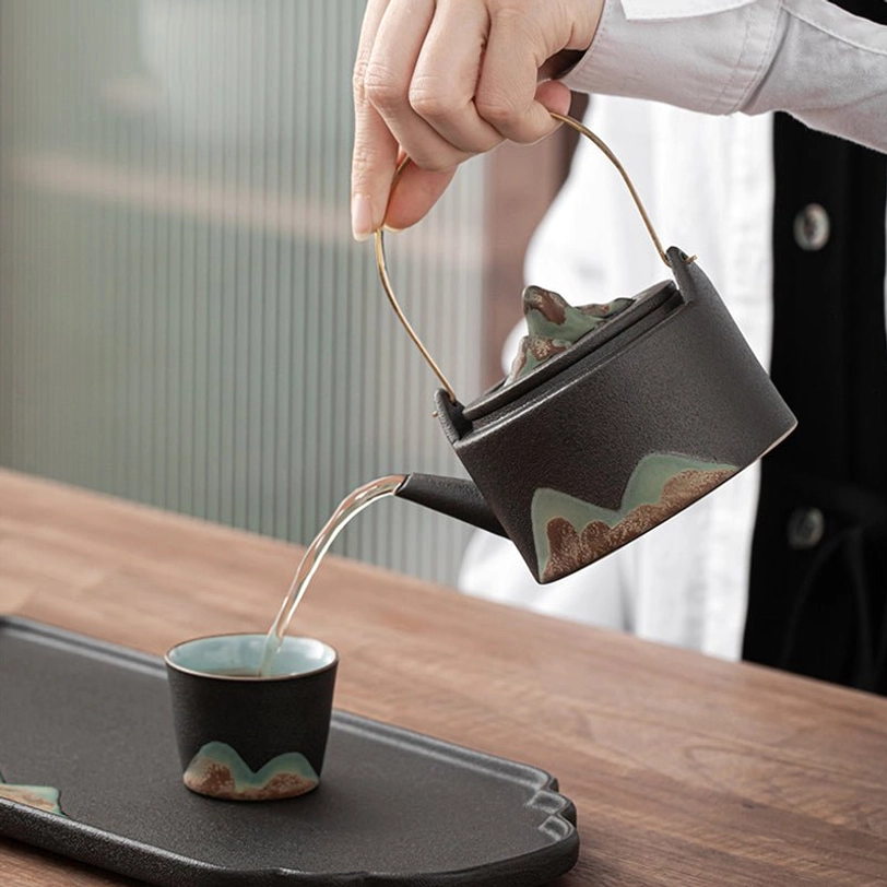 side view of mountain pattern ceramic teapot with infuser 220ml