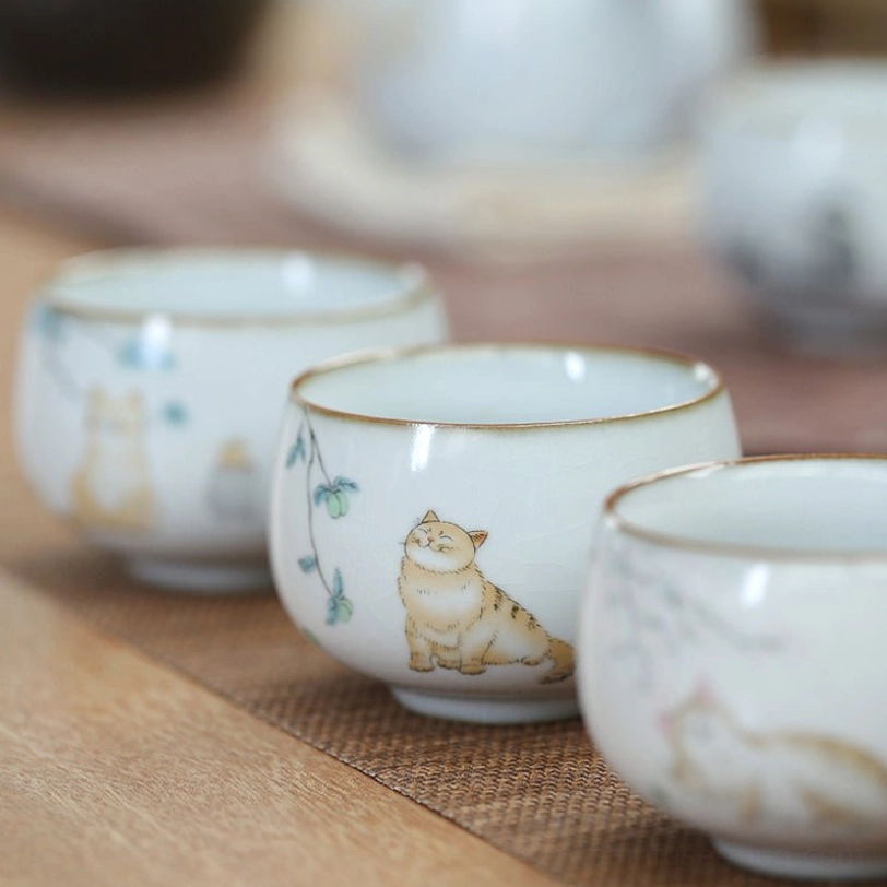 side view of rounded cat motif ceramic chinese tea cup