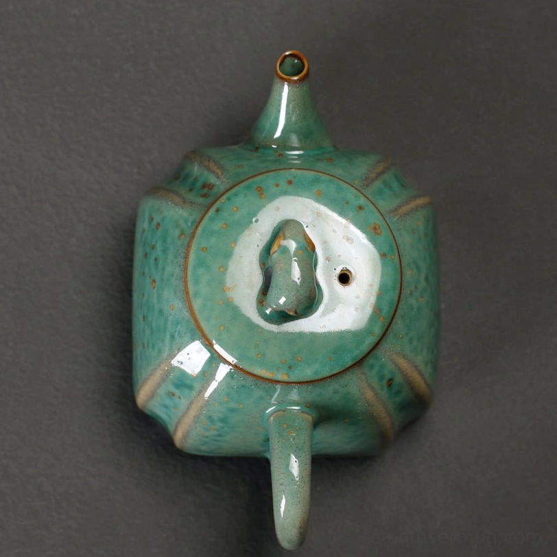 size comparison of the green elephant teapot with infuser