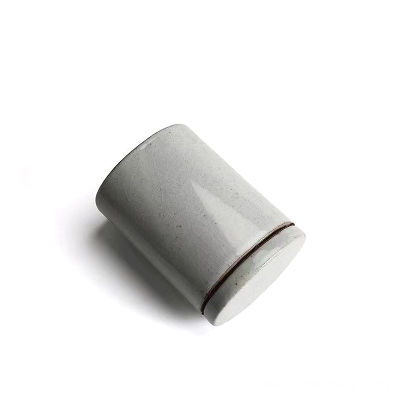 size comparison of 300ml ceramic tea storage canister with a hand