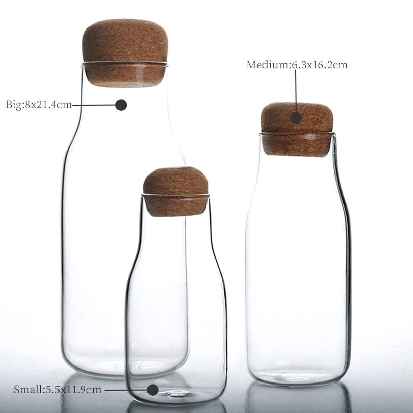 small glass tea storage canister holding loose leaf tea