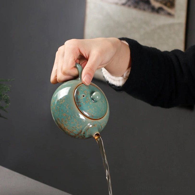 demonstration of smooth pouring from the speckled ceramic teapot