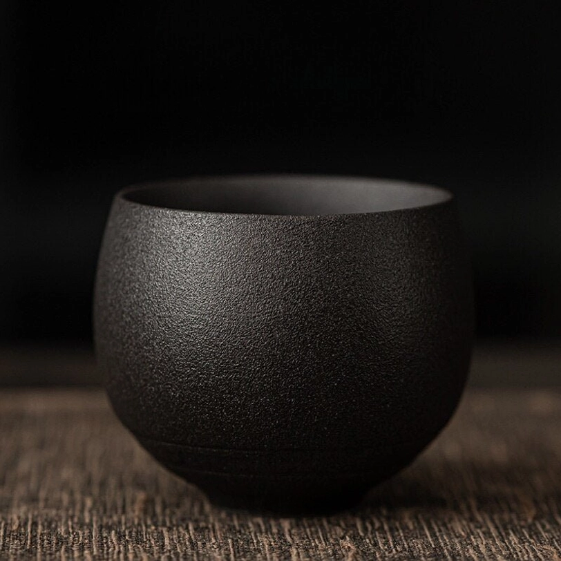 solid black matte vintage Chinese clay tea cup side view