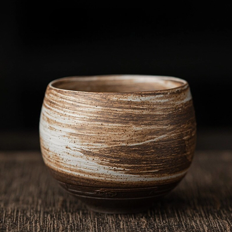 spiral textured brown white Chinese clay tea cup side profile
