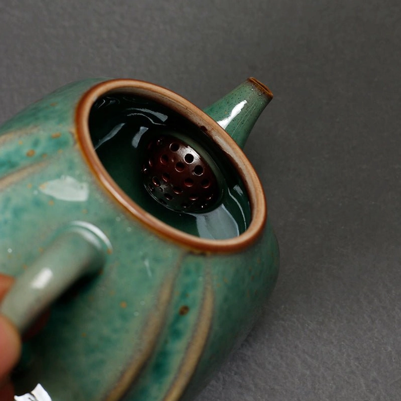 spout and handle detail of 250ml green ceramic teapot