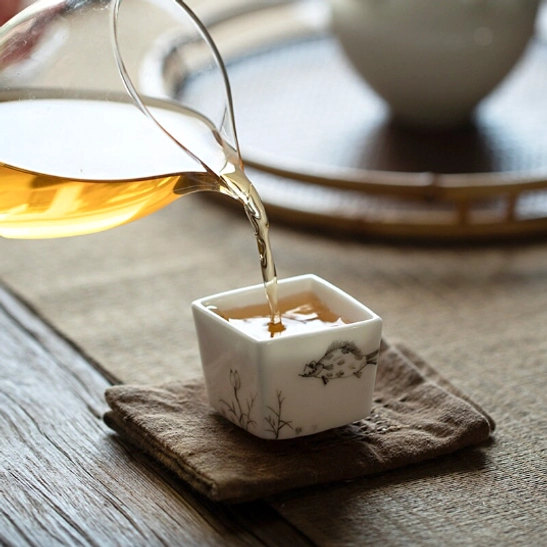 Chinese tea cup filled with brewed green tea