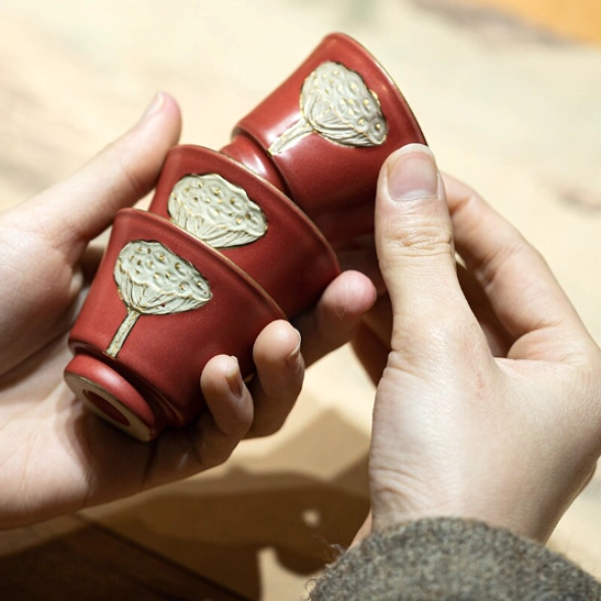 multiple colored lotus tea cups stacked to show space saving storage